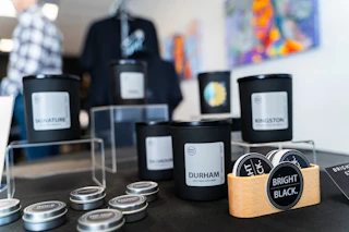 Photo of Bright Black candles and minis, including the "Durham" scent.