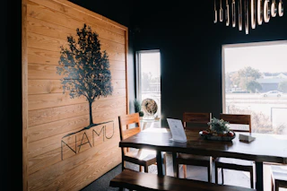 Namu's cozy seats, low light, and earth tones offer a tranquil retreat for cafe visitors.