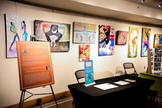 Art from the Founding Fathers of Hayti exhibit lines the walls of the Hayti Heritage Center.