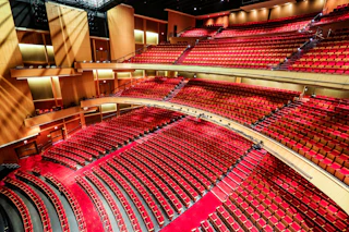 A wide-angle view displays the large amount of comfortable seating in the Durham Performing Arts Center.