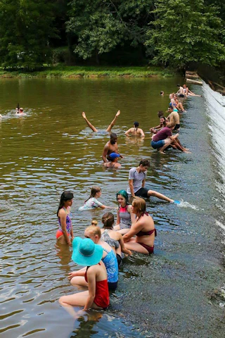 People swimming in the Eno River at Westpoint on the Eno. Durham, NC